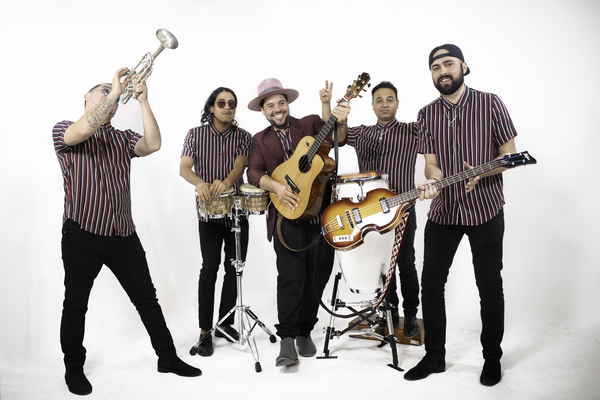 Dynamic band displaying their distinct fashion and eagerness to perform with musical instruments in hand | Altus Entertainment